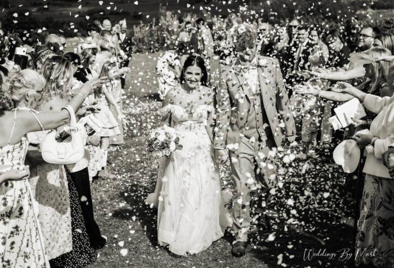 Confetti moment at a Greater Manchester wedding, photographed by Weddings By Mark